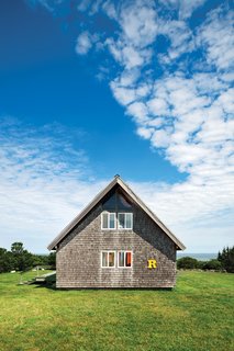 A bright-yellow "R" sign, from a truck that used to deliver furniture from Jens Risom Design, sets off the southern facade. When Jens designed the house, he stipulated that he wanted cedar shingles, not the asphalt ones that came with the original design from the catalog.