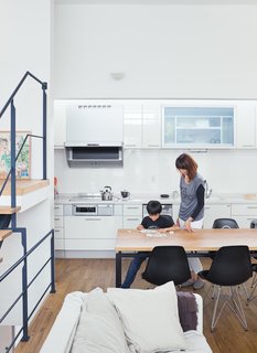 Small Box Home with Black Metal Facade in Japan - Photo 5 of 14 - Called the "LDK," for living, dining, and kitchen, the space is flexible—a blend of Western loft life and traditional Japanese homes, where rooms are multipurpose.