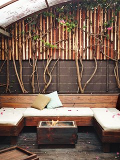 Kartheiser’s private courtyard includes a covered seating area and fire pit, designed by Roberts.
