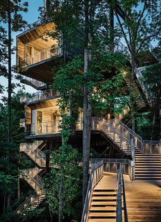 15 Brilliant Designs That Work Around Nature - Photo 11 of 15 - Architecture firm Mithun designed the tree house so that it would tread lightly on the land. The firm originally considered prefabricating the entire structure offsite but, in the research process, concluded that craning large modules into place would potentially harm the canopy. A combination of a bolted-together prefab structure and site-built wood housing yielded the least intrusive construction option.