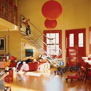 Lewis descends a metal-tube set of stairs fabricated by a maker of ship’s ladders. A banister from the original restaurant stairway serves as a railing for the sleeping loft.