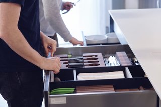 Their systems include award-winning components like the Drawer Accessory System, shown here with a construction of Paperstone and solid surface acrylic—both materials traditionally used in countertops. This addition extends high-performance function to the interior of a system, where users actually interact with it the most. As homeowners’ needs evolve, they can arrange the reconfigurable dividers in any way they desire. The pieces simply snap back together, thanks to a number of small magnets that are carefully embedded.