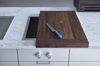 After just one day of using the kitchen, the team realized that they could design special cutting boards that slide on and off the Gaggenau modular cooking units. This way, they’d be extending the amount of usable counter space while introducing a whole new level of customization. They made it happen that same night.