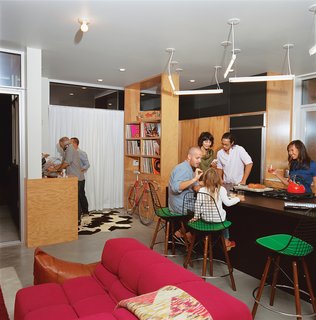 How to Design a Kitchen That’s Ideal For Entertaining—and Shop Our Picks - Photo 2 of 9 - The resident of this home wanted to be able to use the space as a fun gathering place for parties, so Bestor set a DJ booth at the edge of the kitchen. Custom plywood shelving holds vinyl records.