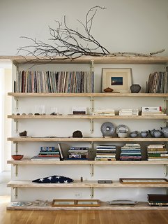 Built-in bookshelves in the living room hold Sanders’s vinyl collection.