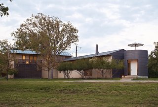 "One of the things Max insisted on," Sanders says, "was that we have views of our own house. That’s why all the sides of the house are different." Some are stucco, others are metal-clad, and ipe latticework encloses one end of the garage.