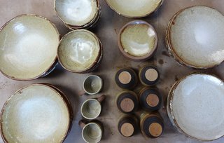 In a city filled with culinary hotspots, Charleston's Husk is in a class of its own. Eschewing the crisp white of haute cuisine standby Limoges porcelain, the restaurant’s muted, weighty ceramics were done locally by design duo Chip Burr and Fiorenzo Berardozzi.