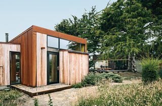 Sea caves on the property forced the architects to split some of the living space into a 483-square-foot guesthouse.