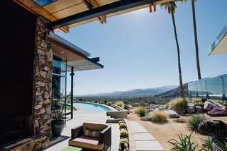 The home’s exteriors wrap around the side, offering additional opportunities to bask in the picturesque surroundings. Photo by: Justin Keena.