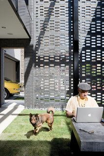 David Hernandez and Jack enjoy the house’s walled garden.