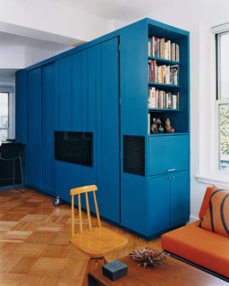 You Can Do It All in 450 Square Feet - Photo 2 of 5 - the blue-lacquered all-in-one cabinet in the fully closed position.