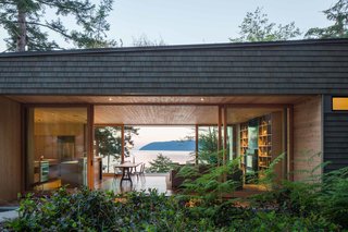 "The home is quite small, but designed in such a way that you don’t feel it," Herrin says. Lift-slide openings by Quantum Windows & Doors, which were fabricated fewer than 50 miles from the house, make the main living space seem larger.