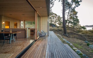 "The layout and openings allow ample flow to the exterior, and paths and decks have been developed to ‘flatten’ the sloping site enough to create generous outdoor gathering areas," Herrin says. "These areas take into account sunlight at different times of day as well as protection from prevailing wind," he adds. One-by-six-foot ipe planks comprise the decking, and hemlock end grain by the Oregon Lumber Company was installed indoors.