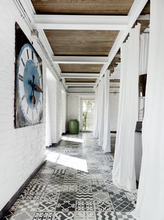 12 Creative Ways to Use Tile in Your Home - Photo 5 of 12 - A carpet of custom tile created by Navone punctuates a corridor on the first floor.