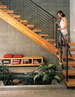 The indoor pond maintains a flora-filled interior even when it's snowing outside.