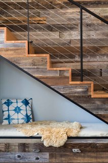 An energy-efficient home mines inspiration from a gold rush town in the California foothills. This cozy reading nook fits underneath the stairs, saving floor space in the 1,690-square-foot home.