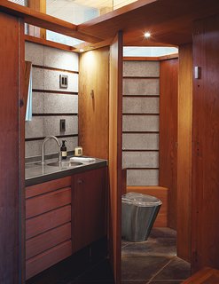 The concrete continues in a bathroom, with an MGS faucet and a toilet from Foshan Fuly Bao.
