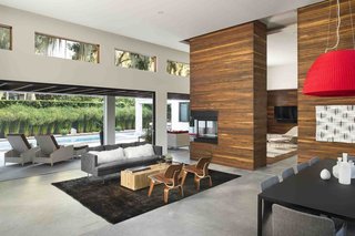 Ipe makes another appearance in the living room, creating a strong indoor/outdoor connection. Kean sited the transom windows to capture views of the moss-covered trees in the backyard.
