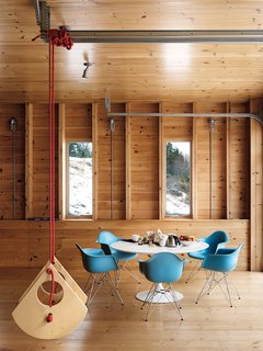 Campbell’s Little Bird swing flies high alongside modern classics like the Eames shell chairs and Saarinen Tulip table.