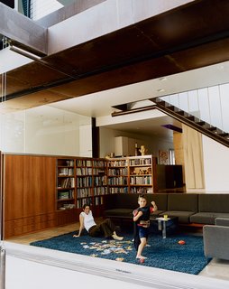 Solar Inspiration - Photo 2 of 8 - Angela Brooks and son Calder revel in the benefits of free solar energy, cheerfully opening the living room’s big glass doors when it’s time to play.