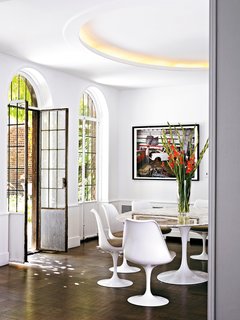 Design Dictionary: Tulip Chair - Photo 10 of 10 - A set of armless Tulip Chairs honors a family legacy in the Director’s House at the Cranbrook Campus. Eliel Saarinen, Eero’s father, designed it.