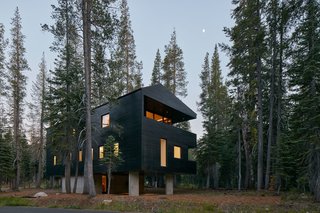 The exterior timber cladding is coated with black tar, a traditional Norwegian treatment. The finish serves a variety of purposes: solar heat gain, water resistance, and insect repellant.