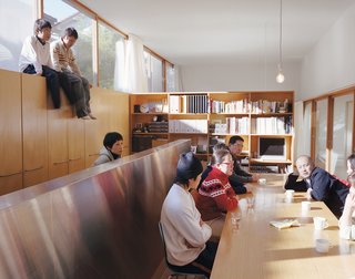 Hidekazu Higashibata wanted to recreate the same sort of feeling he’d experienced on trips to Italy—a long table, leisurely meals, and lengthy conversations. The boys discovered the home’s "second story" on top of the cabinetry and, armed with a ladder, like to perch there for better views.