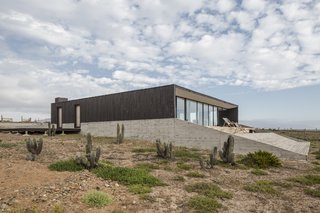 Pine was used for the exterior siding and the lower perimeter base is lined in reinforced concrete.