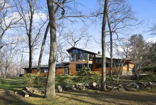 When Moser first arrived on the site, the original home had almost no good views of the neighboring Saxon Woods. The solution was to build expansive Low-E windows to enjoy views of the woods.