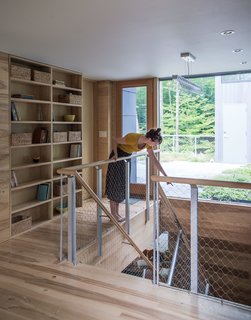 Beyond the second-floor landing, a garden roof filters rainwater and provides insulation.