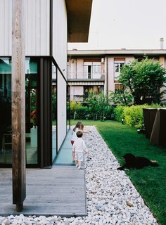 The homes were designed to maximize the indoor/outdoor experience. "On long weekends, we sit in the garden, invite friends, and make a barbecue. It’s like we’ve gone on holiday without leaving home," says resident Luca Pagnan.