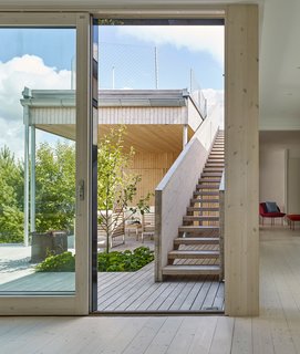 A staircase leads to a roof deck with striking views.