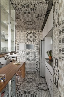 Above is an example of graphic tiles covering the floor, walls, and ceiling. 