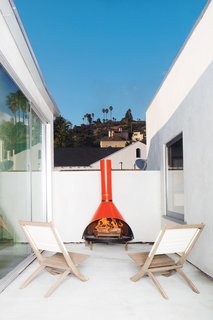 A fireplace found at the Rose Bowl Flea Market furnishes another of the new deck spaces.