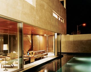 Apart from being visually stunning, the reflecting pool just outside of the living room also acts a sound barrier—the gurgling water cancels out traffic noise.