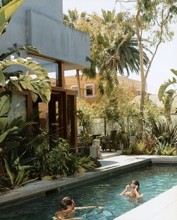 Sophie and Colin enjoy their new pool, the only non-solar-powered portion of their home in Venice, California, created by their father, architect David Hertz. Read the full article here.