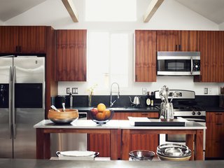 Inspired Indoor Teak Looks - Photo 7 of 14 - He worked with Kartheiser’s existing appliances in the kitchen, trading the old cabinetry for new teak.