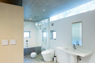 Inside, the bottom floor contains the bedroom, off of which is the bathroom, with a tub from Kaldewei and a Duravit sink.