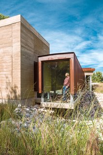 A Sustainable Rammed Earth Home in New Mexico - Photo 2 of 5 - Governed by Roger Downey's strict mandate for minimalism, architect Efthimios Maniatis was able to craft eco-friendly features around the thermal properties of the rammed-earth walls. Photo by: Kirk Gittings