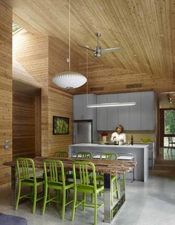 Material continuity speaks to both minimalist modernism and to simplifying costs: Cedar was used throughout, on the interior walls and ceilings, on the roof, and as exterior cladding. Photo by Shai Gil.