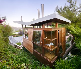 Large floor-to-ceiling windows and doors provide abundant natural light and ventilation.