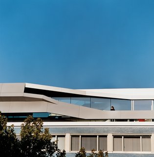 The Penthouse Has Landed - Photo 1 of 16 - Sweeping diagonals cut across the façade of House Ray 1 to provide privacy and a modicum of safety for a dramatic outdoor terrace.
