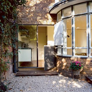 With no space to waste, London-based designers Kim Colin and Sam Hecht turned a 1924 garage into a perfect kitchen.