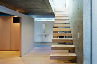 The staircase leads to the living area upstairs.