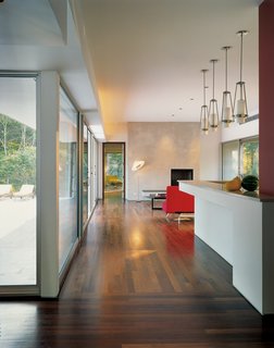A view through the kitchen/living area, with the door to the master bedroom at the far end.