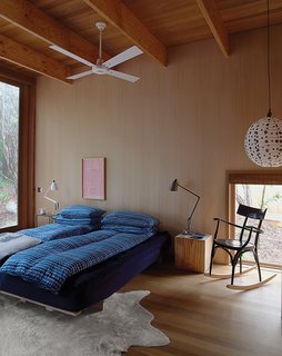 In the master bedroom, the rocking chair is by Thonet and the bespoke rug is by Armadillo & Co.