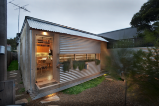 Compact Australian Home Clad in Steel and Concrete - Photo 1 of 10 -