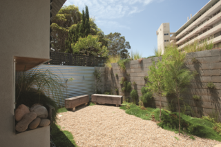Compact Australian Home Clad in Steel and Concrete - Photo 9 of 10 -