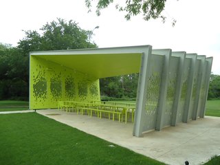 The arresting lime-green interior makes the pavilion at once blend with and stand out from its surroundings. Photo by Architexas.