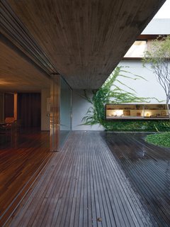 Four custom-built sliding doors divide indoor and outdoor spaces.